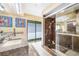 The bathroom features a granite countertop, walk-in shower, and a window overlooking a private backyard at 250 Cortland Ave, Winter Park, FL 32789