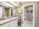 Bright bathroom with a large vanity, granite countertop, ample storage, and a large mirror at 250 Cortland Ave, Winter Park, FL 32789