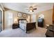Serene bedroom with neutral tones, plush bedding, ceiling fan and sliding glass door leading to the patio at 250 Cortland Ave, Winter Park, FL 32789
