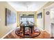 Stylish dining room with hardwood floors, decorative light fixture, and artwork, creating an inviting atmosphere for meals at 250 Cortland Ave, Winter Park, FL 32789