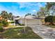 Single-story home featuring a two-car garage and a well-manicured front yard at 250 Cortland Ave, Winter Park, FL 32789