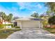 Charming home featuring a two-car garage, well-maintained lawn and lush landscaping at 250 Cortland Ave, Winter Park, FL 32789