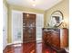 Elegant foyer featuring a wood door, hardwood floors, a decorative console table, and natural light from the sidelight window at 250 Cortland Ave, Winter Park, FL 32789