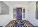 Charming entryway featuring a colorful purple door with decorative wreath and stylish patterned flooring at 250 Cortland Ave, Winter Park, FL 32789
