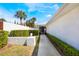Inviting walkway leading to a charming home with meticulously maintained landscaping and a statement purple door at 250 Cortland Ave, Winter Park, FL 32789