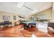 Bright game room featuring a billiard table, skylights, and access to the outdoors at 250 Cortland Ave, Winter Park, FL 32789