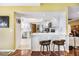 Contemporary kitchen featuring white cabinets, stainless steel appliances, and bar seating area at 250 Cortland Ave, Winter Park, FL 32789