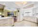 Bright kitchen features sleek white cabinets, modern appliances, and ample counter space with an adjacent dining area at 250 Cortland Ave, Winter Park, FL 32789