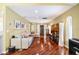 Bright living room boasts sleek hardwood floors, recessed lighting, and neutral walls for a comfortable and welcoming space at 250 Cortland Ave, Winter Park, FL 32789