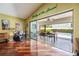 Open living room with hardwood floors, high ceilings, pool access, and a view of the covered patio at 250 Cortland Ave, Winter Park, FL 32789