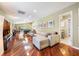 Spacious living room with hardwood floors, contemporary decor, and abundant natural light at 250 Cortland Ave, Winter Park, FL 32789
