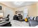 Well-lit home office or bedroom with neutral walls, closet, wood-look floors and a comfortable work space at 250 Cortland Ave, Winter Park, FL 32789