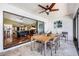 Covered patio with modern outdoor furniture, ceiling fan, and open view into the game room at 250 Cortland Ave, Winter Park, FL 32789