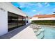 Relaxing outdoor pool area with a built in jacuzzi and poolside access to the home at 250 Cortland Ave, Winter Park, FL 32789