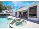 Backyard pool with hot tub area and patio for entertaining, easily accessible from the dining area through sliding glass doors at 250 Cortland Ave, Winter Park, FL 32789