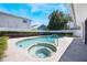 Stunning backyard pool area features a jacuzzi and refreshing pool, perfect for outdoor relaxation at 250 Cortland Ave, Winter Park, FL 32789