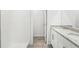 A clean bathroom features tile flooring, a tiled walk-in shower, and a granite-topped vanity with double sinks at 2507 Linda Knoll Ln, Bartow, FL 33830