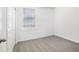Clean, carpeted bedroom featuring neutral walls, a window with blinds, and a closet for versatile use at 2507 Linda Knoll Ln, Bartow, FL 33830