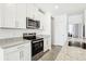 Kitchen with granite countertops, stainless steel appliances, and white shaker cabinetry at 2507 Linda Knoll Ln, Bartow, FL 33830