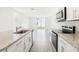 A sleek kitchen boasts granite countertops, stainless steel appliances, and an open concept layout at 2507 Linda Knoll Ln, Bartow, FL 33830