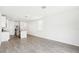 Bright living room with tile flooring, a kitchen with an island, and natural light at 2507 Linda Knoll Ln, Bartow, FL 33830