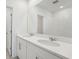 Bathroom with double sink vanity, modern faucets, and a large mirror at 2514 Linda Knoll Ln, Bartow, FL 33830