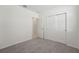 Simple bedroom with neutral carpet and closet doors at 2514 Linda Knoll Ln, Bartow, FL 33830