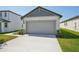 Attached two-car garage featuring a concrete driveway and neutral color palette at 2514 Linda Knoll Ln, Bartow, FL 33830