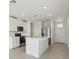Bright kitchen featuring stainless steel appliances, a central island with a sink, and ample cabinet space at 2514 Linda Knoll Ln, Bartow, FL 33830