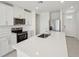 Modern kitchen with stainless steel appliances, a large island, and sleek countertops for gourmet cooking at 2514 Linda Knoll Ln, Bartow, FL 33830