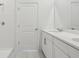 Bathroom with double vanity and white cabinets at 2515 Linda Knoll Ln, Bartow, FL 33830