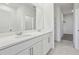Bathroom with double vanity, modern fixtures, and convenient walk-in shower at 2515 Linda Knoll Ln, Bartow, FL 33830