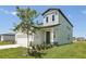 Well-maintained home featuring a manicured lawn, green door, and neutral-colored siding at 2515 Linda Knoll Ln, Bartow, FL 33830