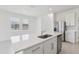 Bright, open kitchen with quartz countertops and stainless steel appliances at 2515 Linda Knoll Ln, Bartow, FL 33830