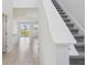 Open-concept living area with tile floors and staircase at 2515 Linda Knoll Ln, Bartow, FL 33830