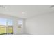 Bright living room featuring sliding glass doors that provide outdoor views at 2515 Linda Knoll Ln, Bartow, FL 33830