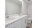 Bright bathroom featuring double sinks, white cabinets, and a shower-tub combination at 2518 Linda Knoll Ln, Bartow, FL 33830