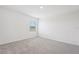 A bright carpeted bedroom featuring a window and white walls at 2518 Linda Knoll Ln, Bartow, FL 33830