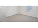 A carpeted bedroom featuring a window, white walls, and a closet at 2518 Linda Knoll Ln, Bartow, FL 33830