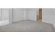 A bright bedroom has neutral walls, and a gray carpet and connects to the bathroom at 2518 Linda Knoll Ln, Bartow, FL 33830