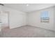 Carpeted bedroom featuring a window, closet, and white walls at 2518 Linda Knoll Ln, Bartow, FL 33830