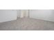 A spacious bedroom features soft carpet, a large doorway, and neutral walls and baseboards at 2518 Linda Knoll Ln, Bartow, FL 33830