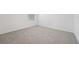 A bright bedroom showcases neutral carpet, white walls, and a window at 2518 Linda Knoll Ln, Bartow, FL 33830