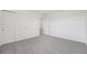 A carpeted bedroom featuring a closet and an open door at 2518 Linda Knoll Ln, Bartow, FL 33830