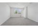 This spacious bedroom includes two large sunny windows, neutral walls, and gray carpeted floors at 2518 Linda Knoll Ln, Bartow, FL 33830