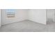 Carpeted bedroom featuring a closet, window, and door at 2518 Linda Knoll Ln, Bartow, FL 33830