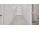 Bright foyer with neutral tile flooring leading to a half bathroom at 2518 Linda Knoll Ln, Bartow, FL 33830