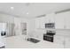 Beautiful kitchen with a large island, stainless steel appliances, and white cabinetry at 2518 Linda Knoll Ln, Bartow, FL 33830