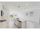 Bright kitchen features an island, stainless steel appliances, and tile flooring, perfect for modern living at 2518 Linda Knoll Ln, Bartow, FL 33830