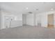 This open loft area is bright and spacious, with connecting doorways and neutral carpet and walls at 2518 Linda Knoll Ln, Bartow, FL 33830